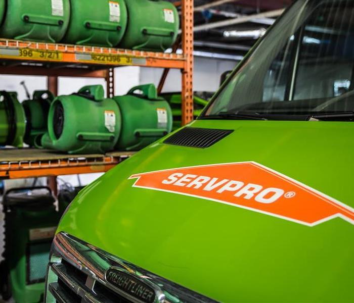 The SERVPRO van resides in the warehouse where it stays surrounded by air movers, dehumidifiers, and other equipment! 