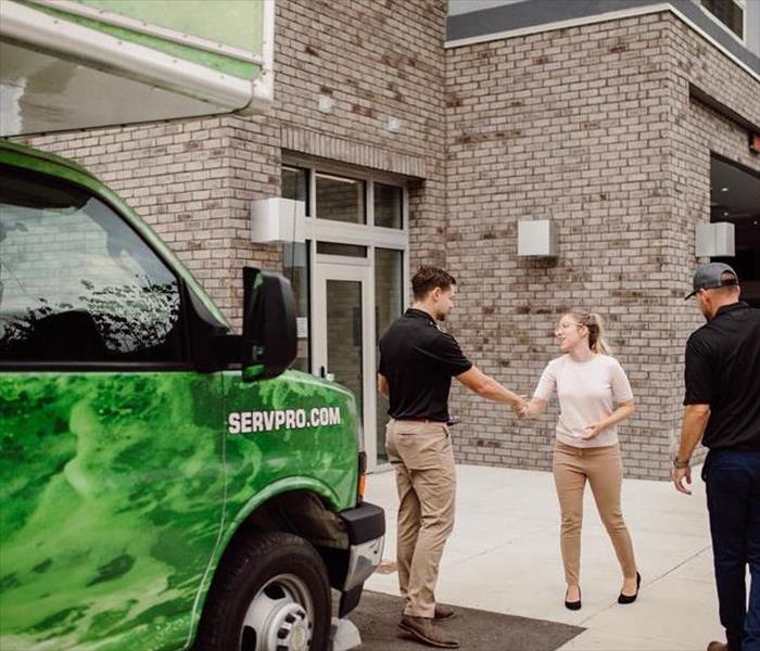 SERVPRO technicians greeting clients