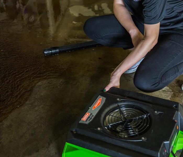 SERVPRO technician cleaning water