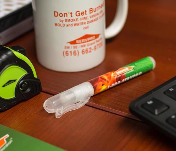 An inch tape, mug, and pen are essential for a day in the life of a SERVPRO professional!