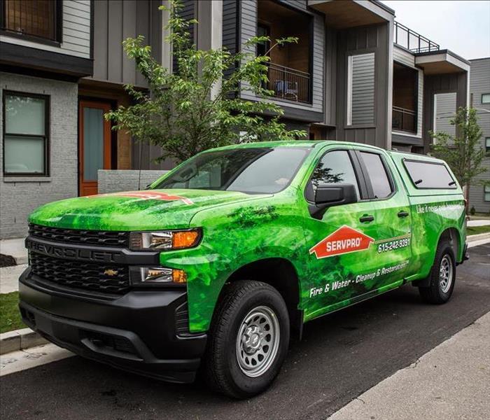 SERVPRO truck outside townhomes