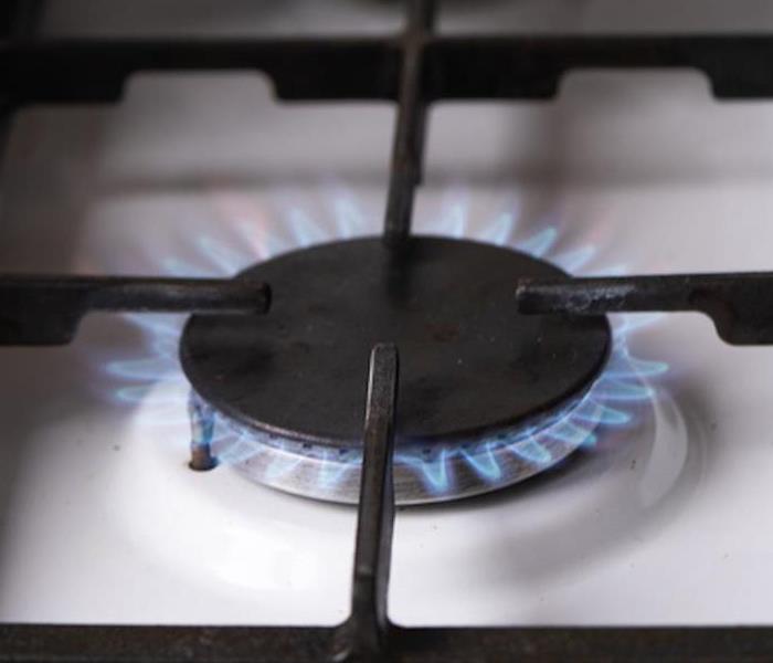 A lit stove burner 
